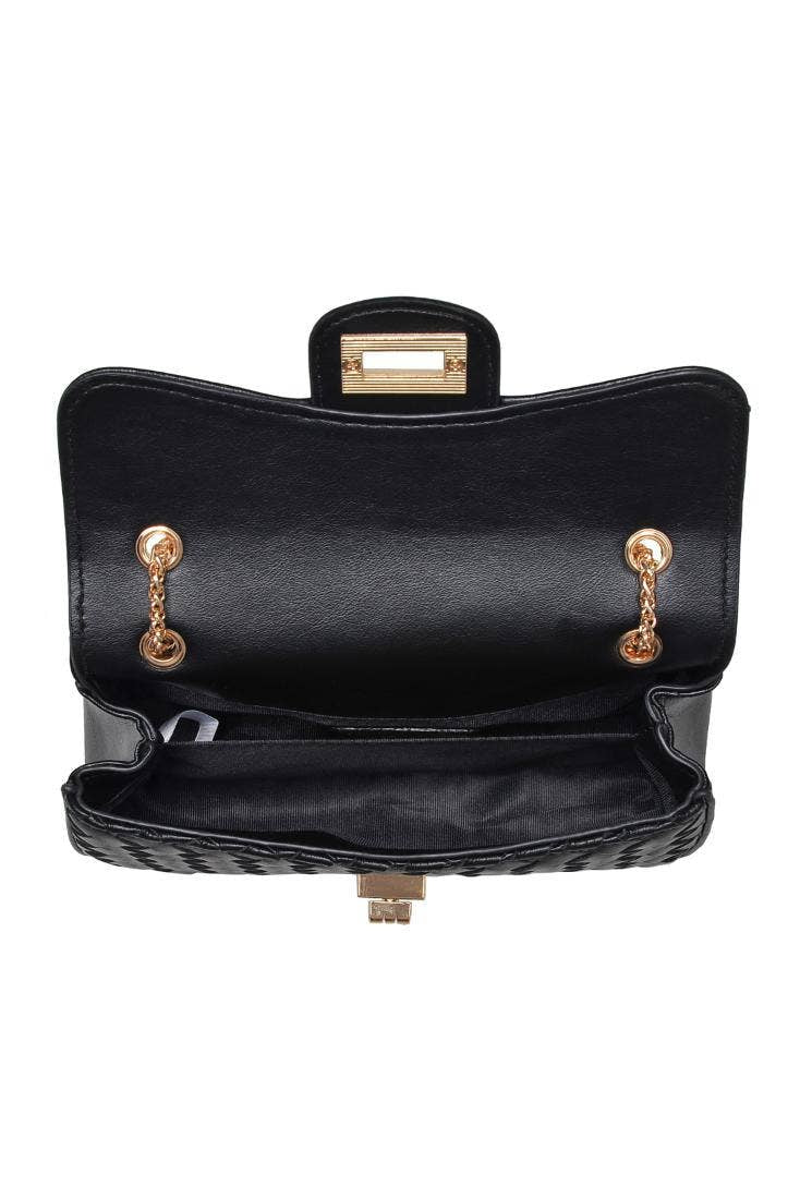 Black handbag with gold hardware on a white background