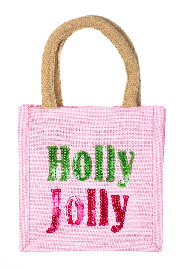 Pink jute bag with 'Holly Jolly' text on a white background