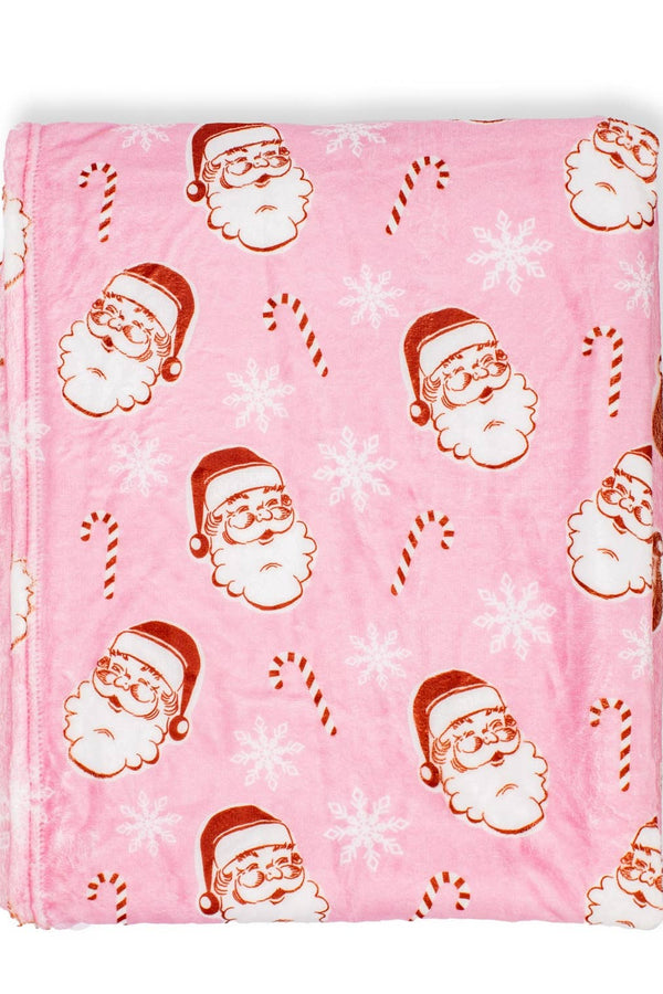 Pink blanket with Santa Claus and candy cane pattern on a white background