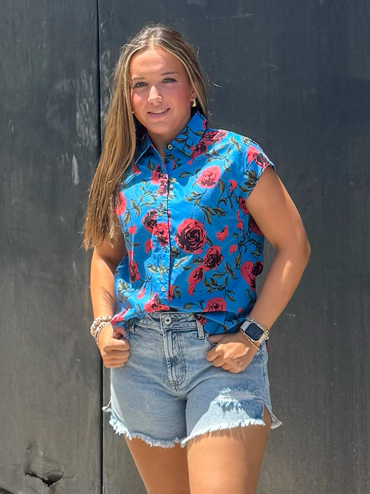 Blue button up top with red roses