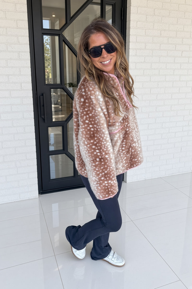 Close-up of soft faux fur texture on mocha deer print pullover