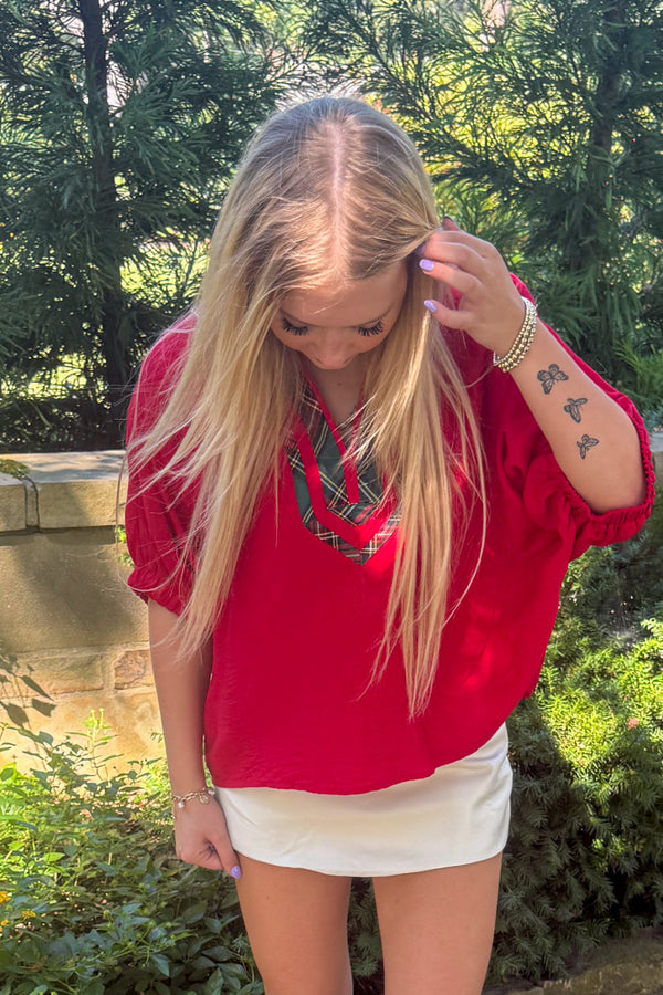 Entro Red Top with plaid trim untucked