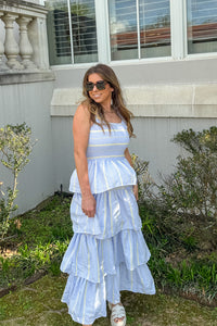 Woman wearing First Class Dreamin blue yellow striped tiered maxi dress by TCEC with smocked bodice