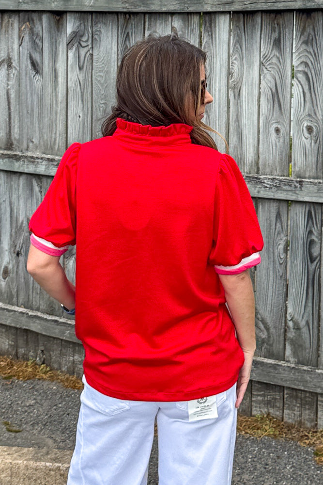 Back view of She's Sporty contrast trim red top by Umgee