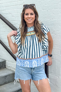 Woman wearing Border Print navy ruffled sleeve top by TCEC featuring striking border print