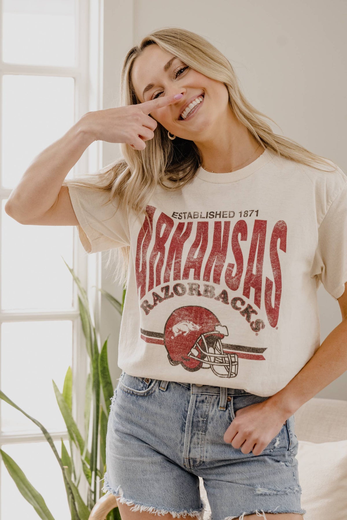 Front view of LivyLu Razorbacks Established Date Helmet Thrifted Tee in off white, oversized fit